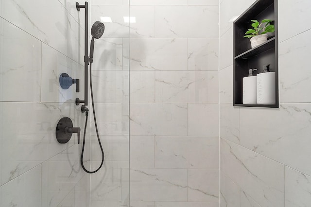 full bathroom with a tile shower