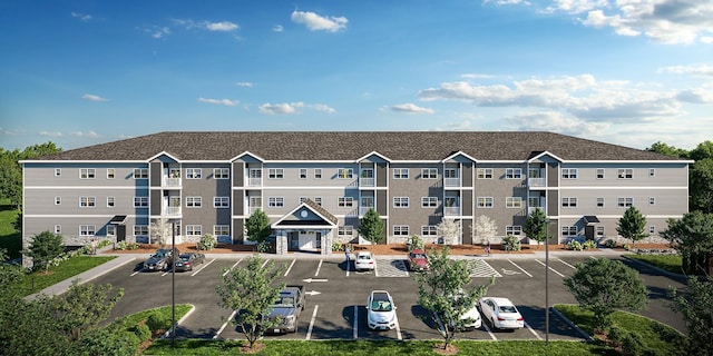 view of property featuring uncovered parking