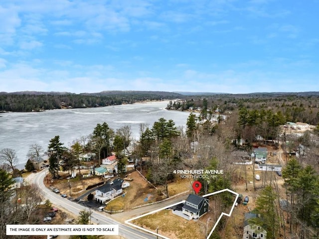 aerial view featuring a water view and a view of trees