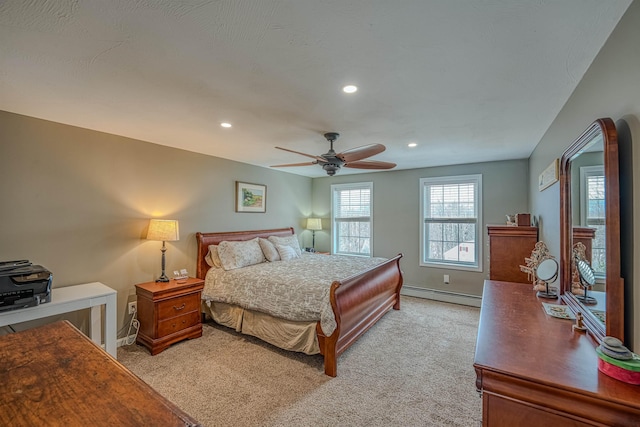 bedroom with baseboards, recessed lighting, baseboard heating, and light colored carpet