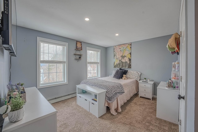 bedroom with recessed lighting, light colored carpet, and baseboard heating
