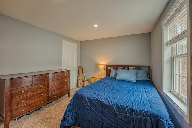bedroom featuring recessed lighting and light carpet