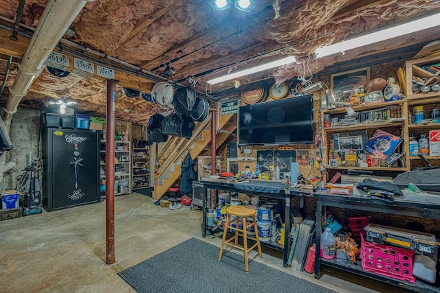 unfinished basement with a workshop area