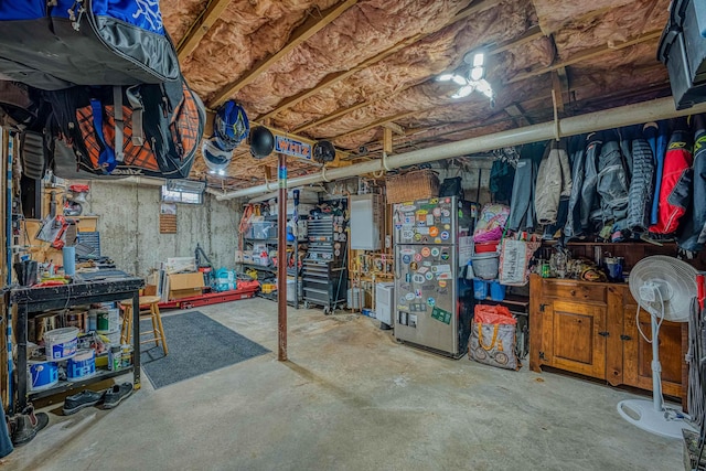 unfinished basement featuring a workshop area