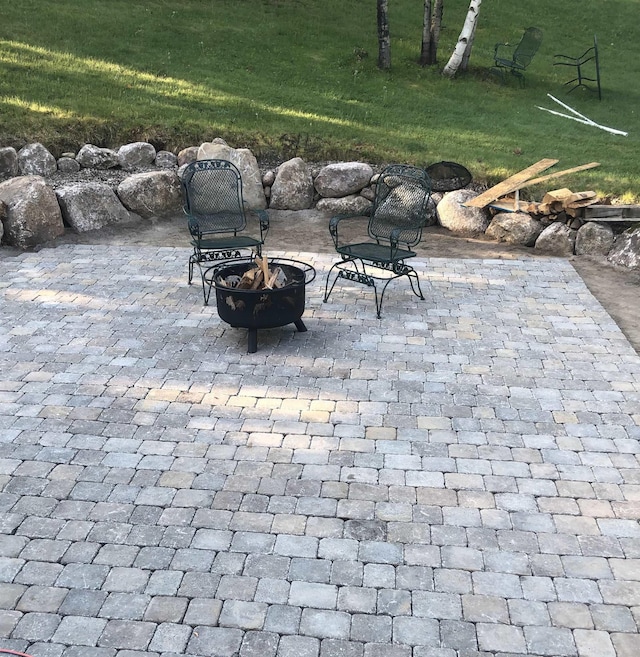 view of patio / terrace with a fire pit