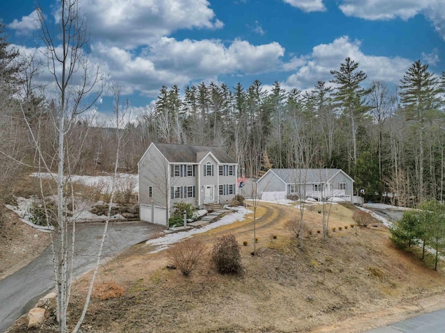 exterior space featuring a wooded view