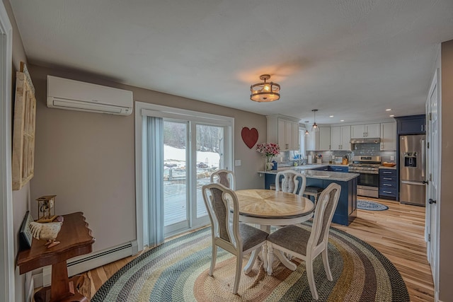 dining space with a baseboard radiator, a wall mounted AC, light wood-style floors, and recessed lighting