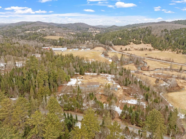 aerial view featuring a forest view and a mountain view