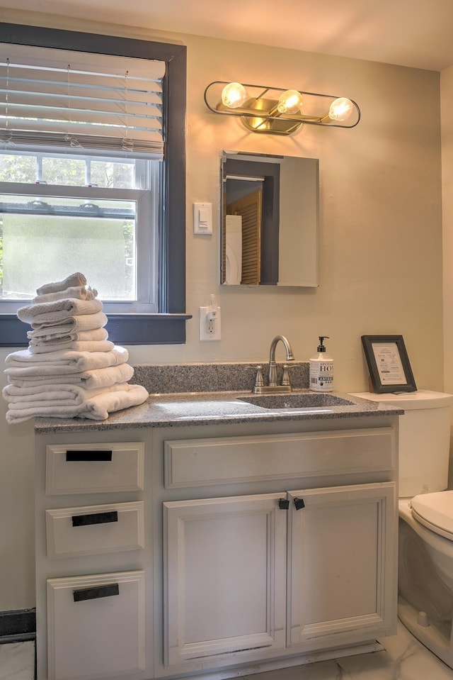 59 Wilson Pond Rd, Swanzey, NH 03431 - half bathroom with toilet and vanity