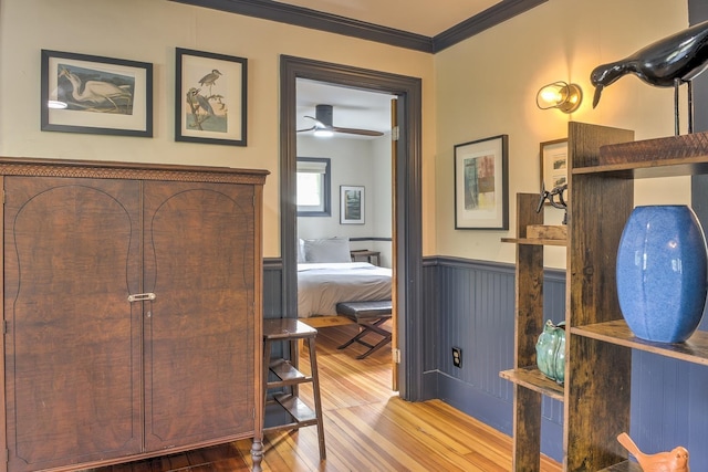 59 Wilson Pond Rd, Swanzey, NH 03431 - corridor featuring wood finished floors, a wainscoted wall, and crown molding