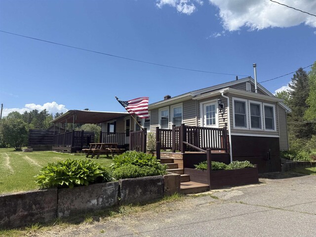 2779 River Rd, Lemington, VT 05903 - view of front of home featuring a deck and a front yard