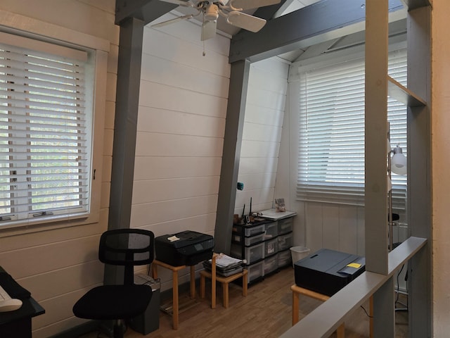 interior space featuring wood finished floors and ceiling fan
