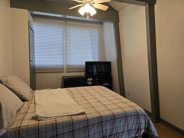 bedroom featuring baseboards and ceiling fan