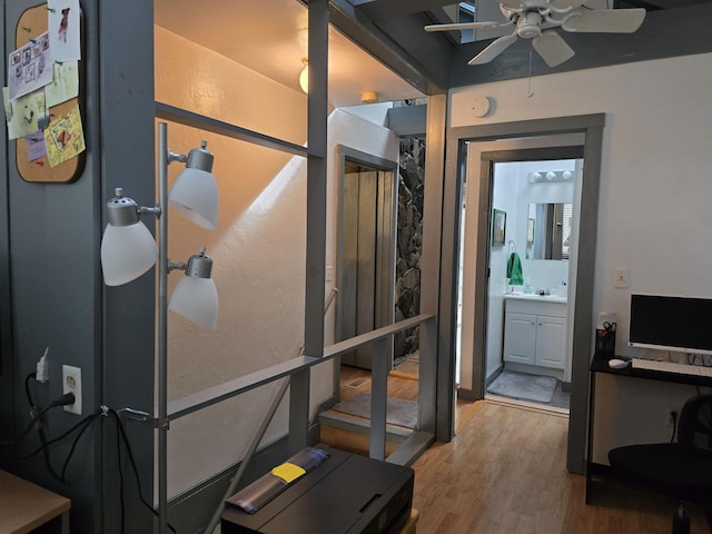 interior space featuring a ceiling fan and wood finished floors
