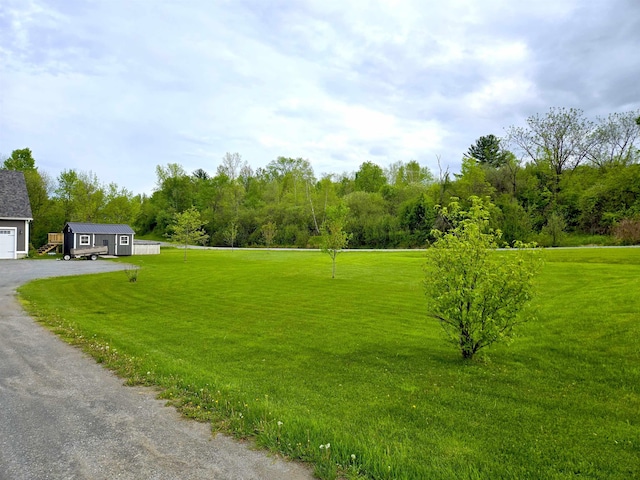 226 St Pierre Rd, Fairfield, VT 05455 - view of grassy yard with a garage and driveway