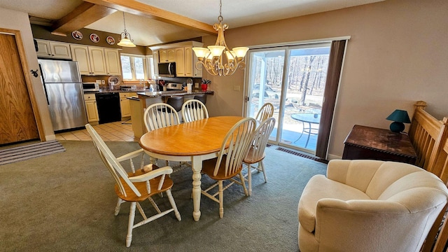 dining space featuring light tile patterned flooring, a chandelier, light carpet, baseboards, and beamed ceiling