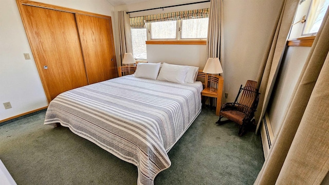 bedroom with a closet, baseboards, and carpet