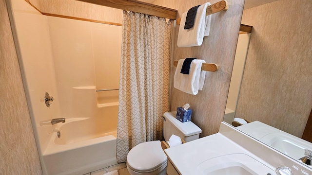 bathroom with toilet, shower / bathtub combination with curtain, and vanity