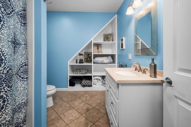 13 Ocean Circuit Dr, York, ME 03902 - bathroom with toilet, tile patterned floors, and vanity