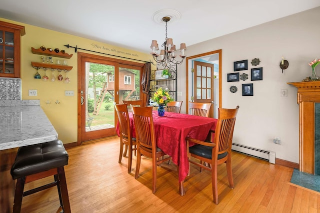 13 Ocean Circuit Dr, York, ME 03902 - dining space with baseboards, light wood-style floors, a chandelier, and baseboard heating