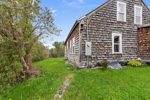 view of home's exterior with a lawn