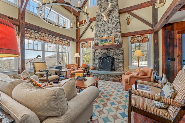 444 Tin Shanty Rd, Shrewsbury, VT 05738 - living area featuring a notable chandelier, beamed ceiling, and a fireplace