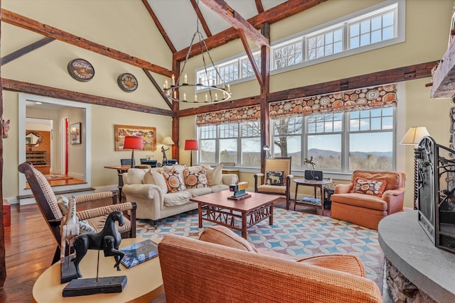 444 Tin Shanty Rd, Shrewsbury, VT 05738 - living room with high vaulted ceiling, a chandelier, wood finished floors, baseboards, and a mountain view