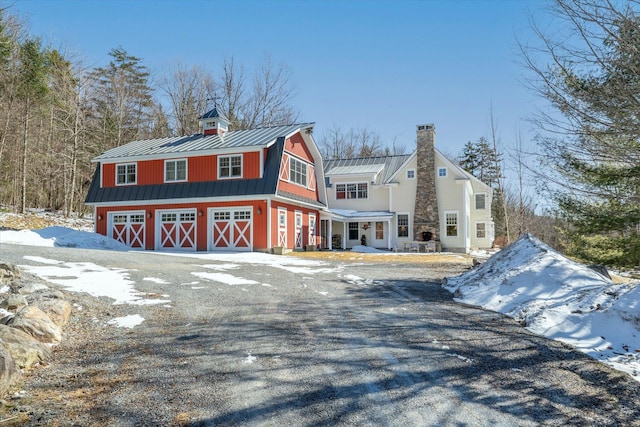 444 Tin Shanty Rd, Shrewsbury, VT 05738 - view of front of house featuring metal roof, a chimney, a standing seam roof, a gambrel roof, and a barn