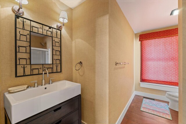 444 Tin Shanty Rd, Shrewsbury, VT 05738 - bathroom with visible vents, baseboards, toilet, wood finished floors, and vanity