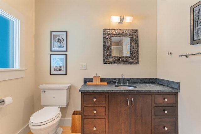 444 Tin Shanty Rd, Shrewsbury, VT 05738 - bathroom featuring baseboards, toilet, and vanity