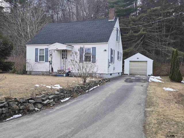 cape cod-style house with driveway, roof with shingles, a chimney, an outdoor structure, and a garage