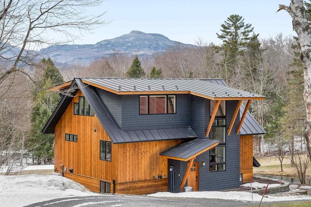 437 Lonesome Trl, Waterbury, VT 05676 - view of front of home with metal roof, a standing seam roof, and a mountain view