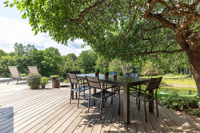 437 Lonesome Trl, Waterbury, VT 05676 - wooden terrace featuring a water view and outdoor dining space
