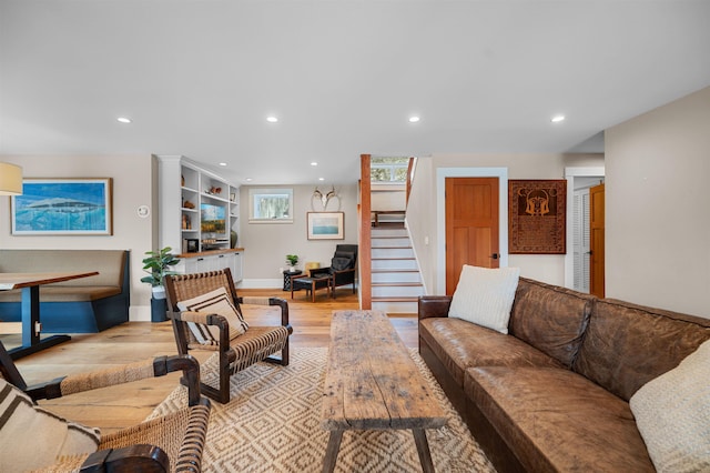 437 Lonesome Trl, Waterbury, VT 05676 - living room with recessed lighting, light wood-style flooring, and stairway