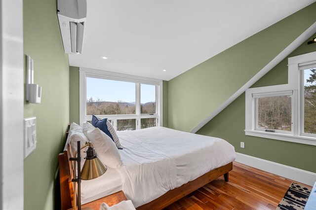 437 Lonesome Trl, Waterbury, VT 05676 - bedroom with multiple windows, recessed lighting, wood finished floors, and baseboards
