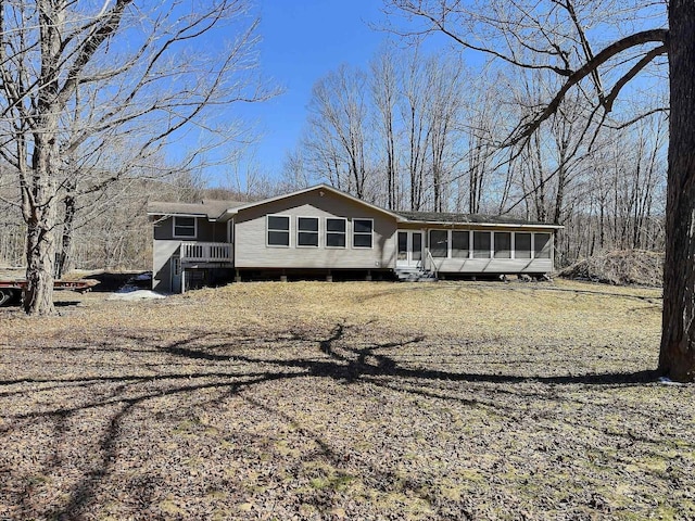 view of front of property with a sunroom