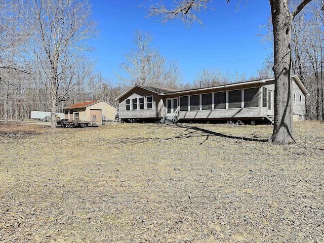 view of front of home with a sunroom