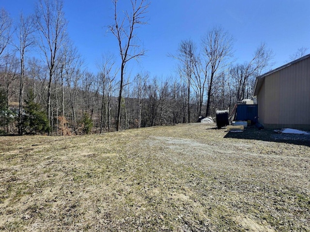 view of yard featuring a view of trees