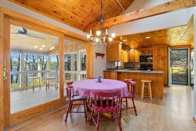 dining room featuring wooden ceiling, light wood finished floors, and vaulted ceiling with beams