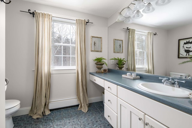 72 Natures Way, Wells, ME 04090 - bathroom with toilet, vanity, and baseboards