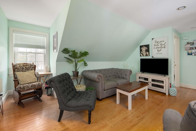 72 Natures Way, Wells, ME 04090 - living room with light wood-style floors, vaulted ceiling, and baseboards