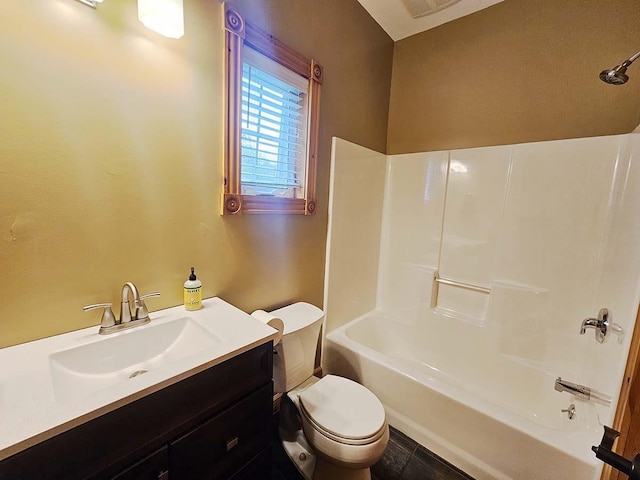 bathroom with toilet, washtub / shower combination, and vanity