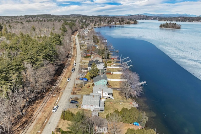 drone / aerial view featuring a water and mountain view
