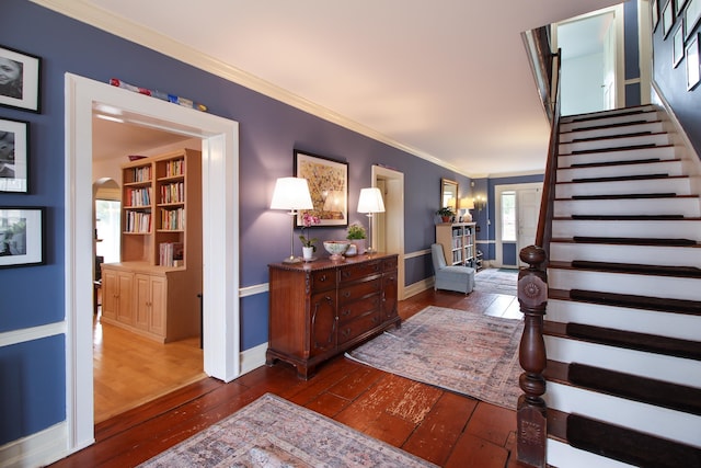 14 Adams Landing Rd, Grand Isle, VT 05458 - foyer featuring crown molding, stairway, dark wood-style flooring, baseboards, and arched walkways