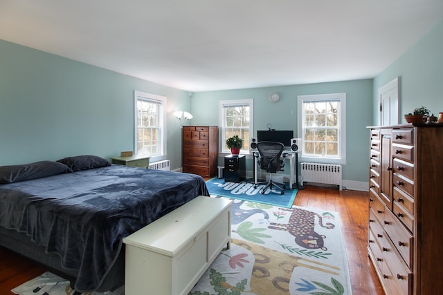 14 Adams Landing Rd, Grand Isle, VT 05458 - bedroom featuring radiator heating unit, multiple windows, and wood-type flooring