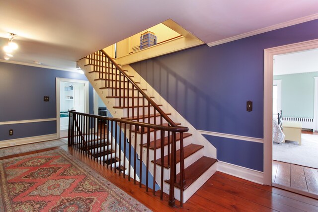 14 Adams Landing Rd, Grand Isle, VT 05458 - staircase with baseboards, ornamental molding, radiator, and hardwood / wood-style flooring