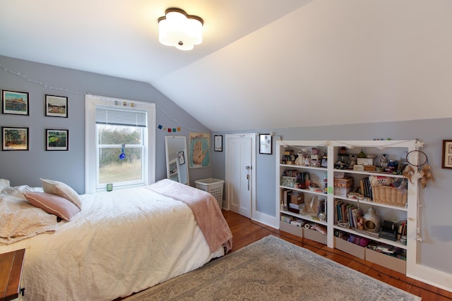 14 Adams Landing Rd, Grand Isle, VT 05458 - bedroom with baseboards, lofted ceiling, and wood finished floors