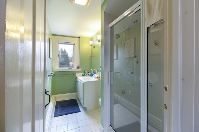 14 Adams Landing Rd, Grand Isle, VT 05458 - bathroom with a shower stall, baseboards, toilet, tile patterned floors, and vanity