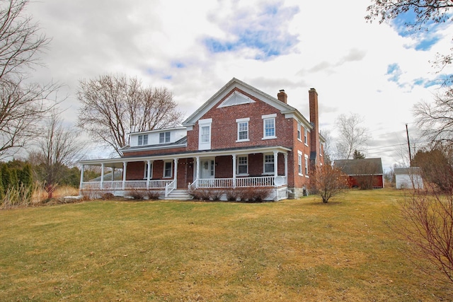 14 Adams Landing Rd, Grand Isle, VT 05458 - view of front of home featuring brick siding, a chimney, a porch, and a front yard