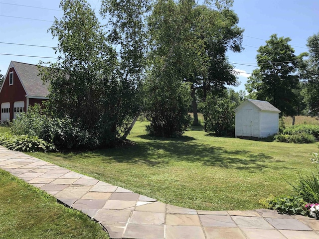 14 Adams Landing Rd, Grand Isle, VT 05458 - view of yard with a storage unit, an outdoor structure, and a garage